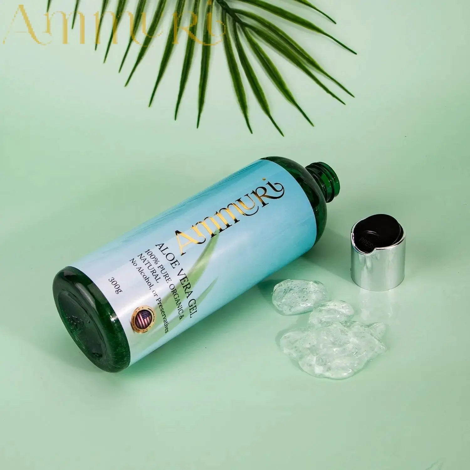 Ammuri Skincare organic aloe vera gel bottle with clear gel and green leaf on light background